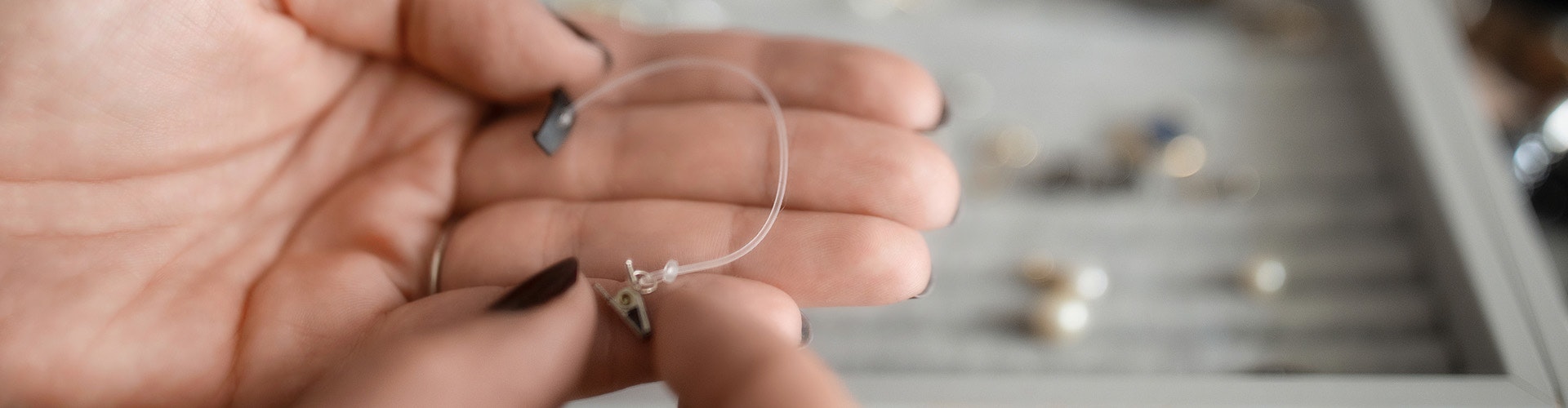 Person showing the Hair Attachement Clip