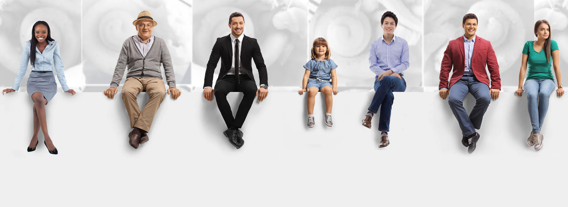 people sitting on a wall